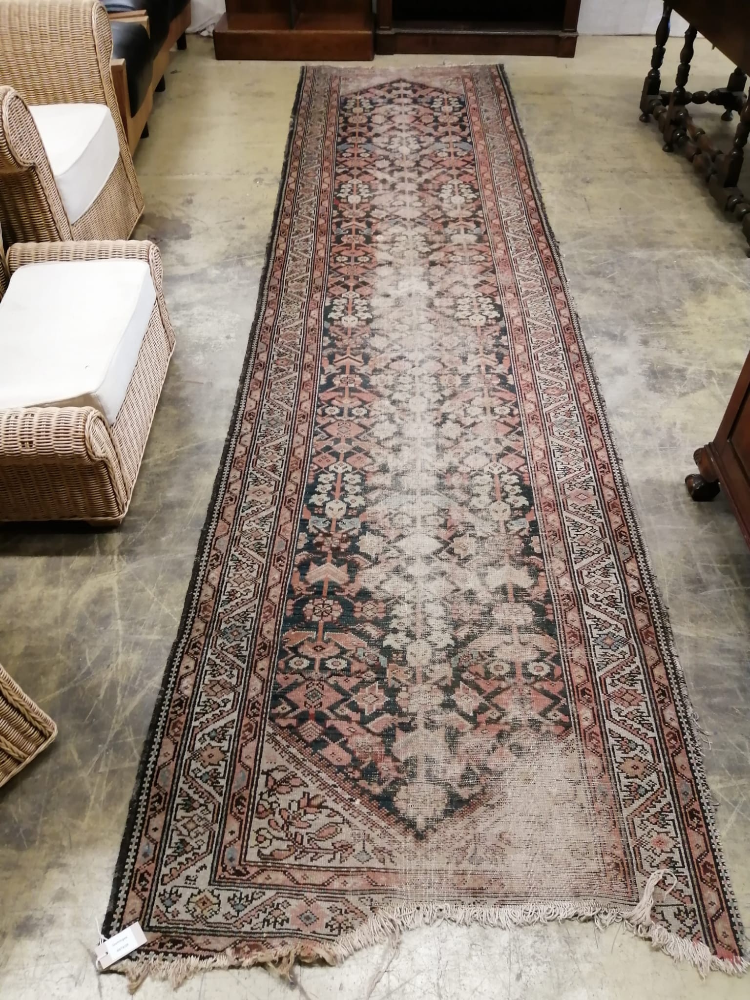 An antique Malayer red ground runner, approx. 260 x 99cm